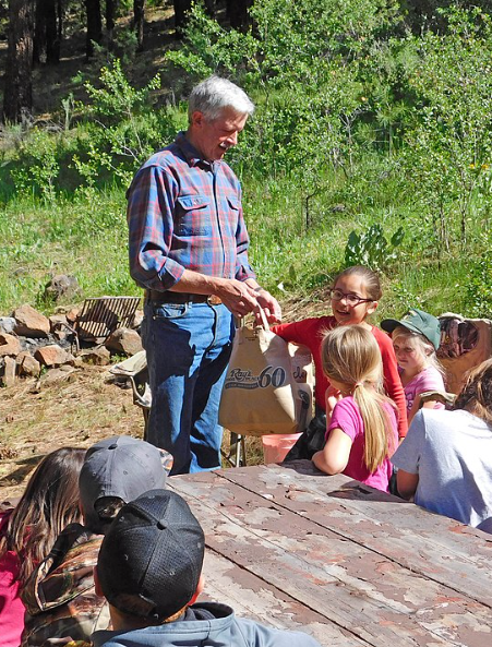 Adult teaching kids outdoors